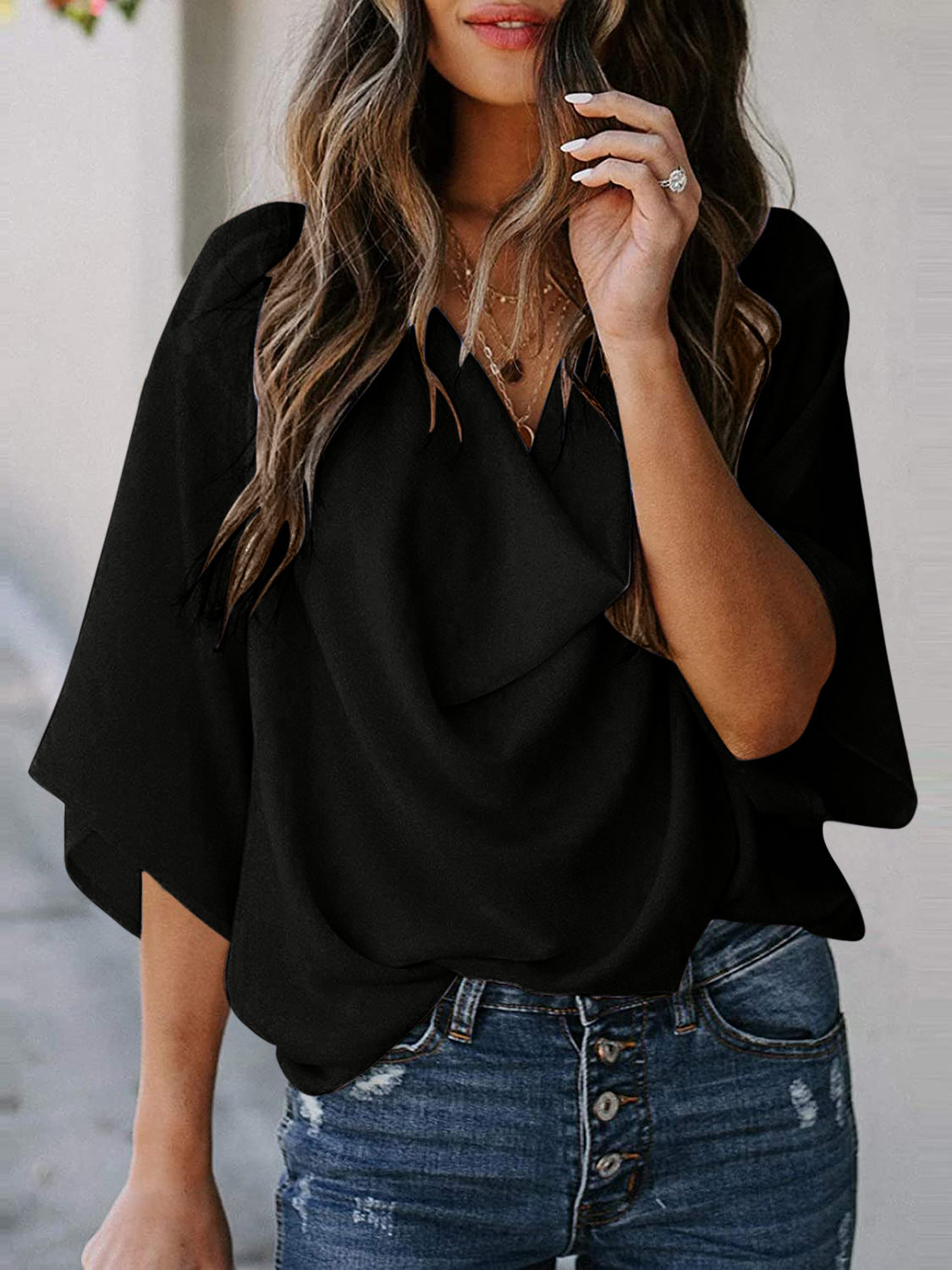 Blusa de manga tres cuartos con cuello vuelto y talla completa