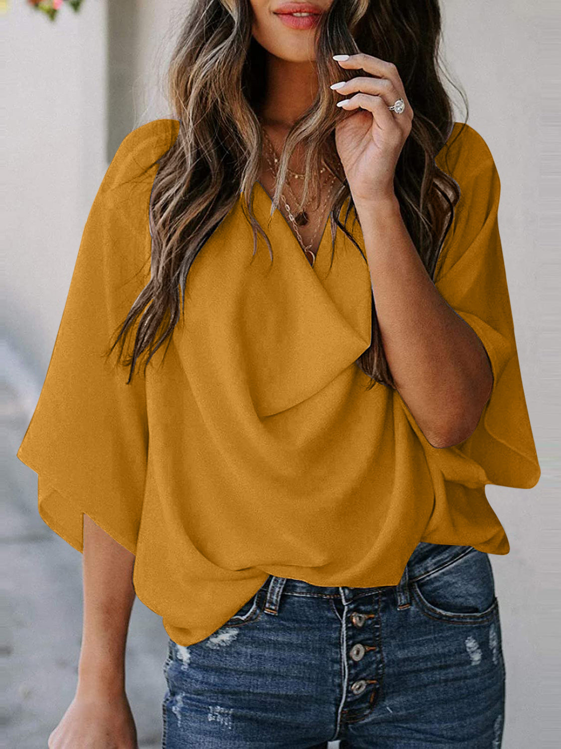 Blusa de manga tres cuartos con cuello vuelto y talla completa