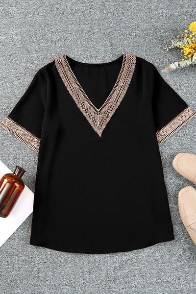 Blusa de manga corta con cuello en V de talla grande