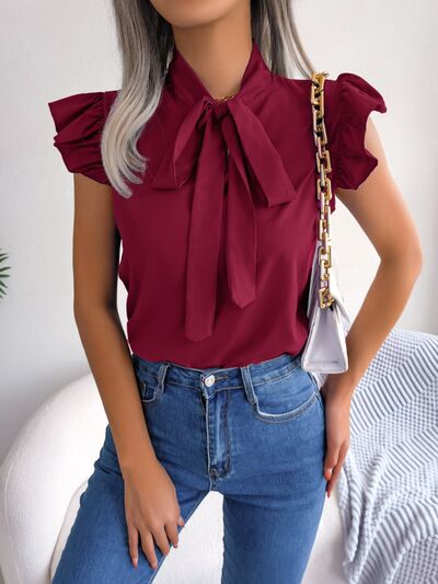 Blusa con mangas japonesas y cuello anudado